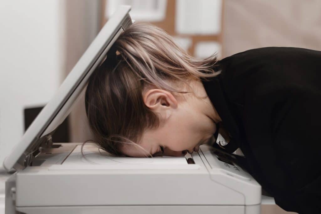 Businesswoman suffering from business printer issues