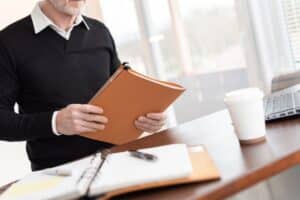 Business man holding custom presentation folder