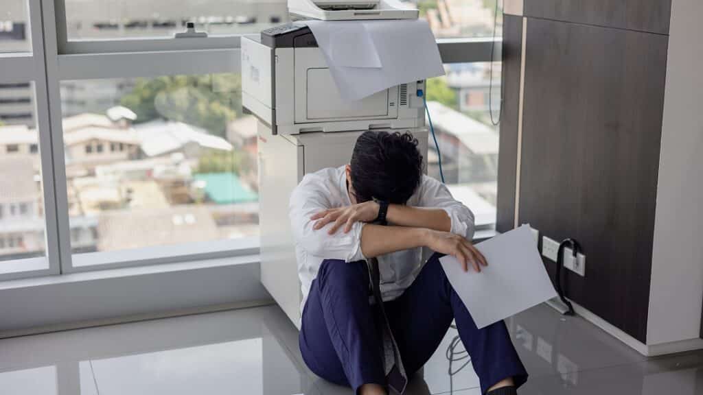 Man struggles with printing problems in his office